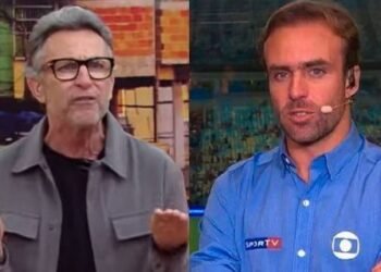 Craque Neto critica Roger Flores e apoia Gabigol ao vivo 38 Dois homens em um debate esportivo na TV, um gesticulando com as mãos e o outro com microfone no estúdio.