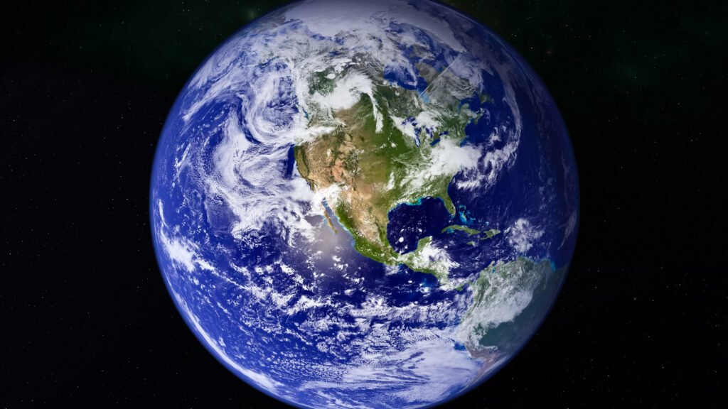 Visão do planeta Terra do espaço, destacando a América do Norte e nuvens sobre o oceano, em um fundo estrelado.
